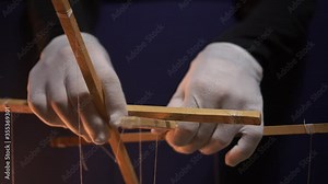 People - puppet dolls marionette controlled from above using wires or strings in the hands of the puppeteer