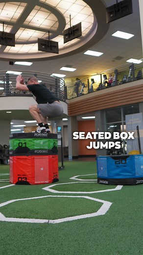 Seated Box Jumps are a great explosive exercise that ignites the nervous system for strength gains.⁣ ⁣ To perform:⁣ 1. Set up your box and seat a few feet apart from each other.⁣ 2. Sit down on the seat facing the box that you’re about to jump up on.⁣ 3. Plant your feet firmly into the ground, with your hands by your side, then raise them above your head, and back down, and as you explosively extend from the hips and jump up and forward, swing them back up.⁣ 4. Land on the box with two feet and 