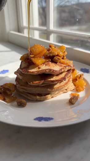 These special occasion-worthy pancakes are inspired by Hummingbird Cake, a moist spiced cake with bananas, pecans, and crushed pineapple. | Epicurious