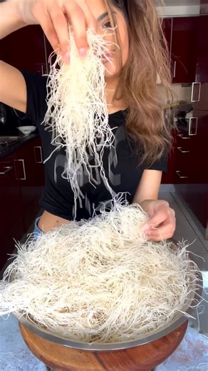 Sanjana Modha on Instagram: "Let’s make Knafeh (or Kunafa). A classic Middle Eastern treat. This beautiful dessert combines crispy pastry, sweet cheese filling, and a drizzle of syrup. It originated in the Palestinian city of Nablus, known for its Nabulsi cheese. I find the Kataifi dough in my local Middle Eastern supermarket. It comes chilled or frozen. This is a thin, shredded phyllo dough, sometimes called ‘knafeh dough’. It’s like angel hair — crispy and absorbent, providing the base and tex