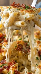Crazy Good Casserole INGREDIENTS: 3 cups Cooked Chicken, shredded or chopped (Rotisserie works perfectly!) 1 lb Penne or Rotini Pasta (cooked al dente) 8 slices Bacon, cooked crispy and crumbled The "Crazy Good" Sauce: 1 jar (15 oz) Alfredo Sauce (or homemade) ½ cup Milk (to thin it out slightly) 1 packet (1 oz) Dry Ranch Seasoning Mix (The secret ingredient!) 2 cloves Garlic, minced The Topping: 2 cups Mozzarella Cheese, shredded 1 cup Cheddar Cheese, shredded (optional) Garnish: Fresh Parsley,