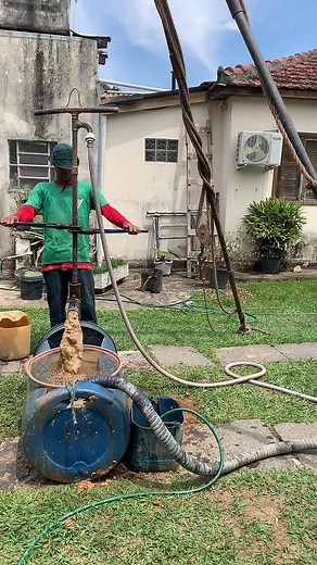 Manual Pump Operation for Soil Extraction