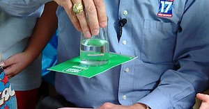 Weather experiment: Water, cardboard, and a glass demonstrate air pressure