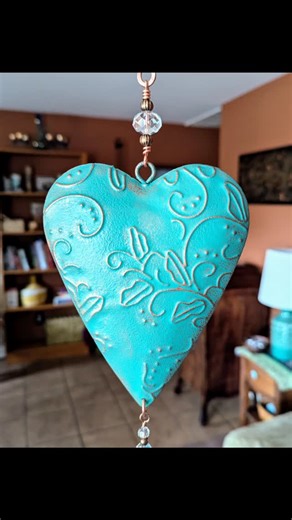 Rustic turquoise metal heart with glass beading and tiny bell. Wall hanging, wind chime, sun catcher, earthy valentine 🩵 art. #metalart #homedecoration #porchlife #turquoiseheart #rusticart | Gathering Stars
