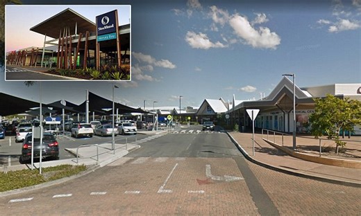 Couple caught as woman's head buried in man’s lap outside mall