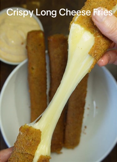 Crispy Long Cheese Fries Ingredients Block Mozzarella cheese All-purpose flour,cornstarch,salt,pepper,garlic powder Eggs,water Breadcrumbs,cornstarch,salt,black pepper,garlic powder,paprika,oregano Oil for deep frying Instructions Cut mozzarella into long fry-shaped sticks Set up 3 bowls: Mix flour,beat eggs with water,In another bowl mix breadcrumbs,cornstarch and seasoning .Coat each cheese in flour,egg and breadcrumbs back into egg and breadcrumbs press crumbs firmly on each stick.Freeze at l