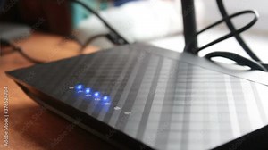 Blinking of the signal indicator on the Wi-Fi router. Blinking wireless network indicators on the wi-fi router.Wi-Fi router with blinking blue signal indicators.