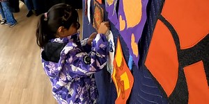Burlington community comes together to create ‘Mending Wall’ quilt