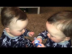 IDENTICAL TWINS Fighting over pacifier!!!