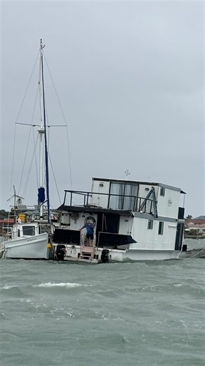 Part 1: This houseboat broke free in heavy winds and became entangled on another vessels mooring. #towingservice #boating #towing #boatlife | Trojan Marine Services