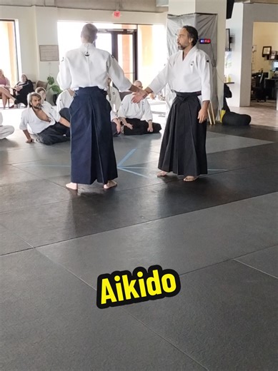 Aikido Masterclass: Katate Dori Kaiten Nage 🥋✨ Watch as our Sensei demonstrates the precise mechanics of Katate Dori Kaiten Nage. This rotary throw is one of the most iconic Aikido techniques, focusing on the perfect blend of timing, distance (ma-ai), and circular motion. In this demonstration, the focus is on the Uchi (inside) variation. Notice how the Sensei uses the opponent's energy from the single-hand wrist grab to initiate the rotation without using brute force. This is essential study f