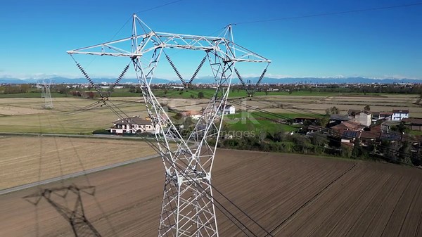 High voltage pylon for the transport of electricity and houses with...