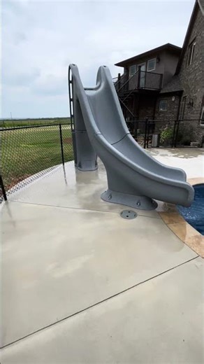 Custom Pool Slide Installation in Oklahoma City | Luxury Backyard Pool Feature by Longevity Pools