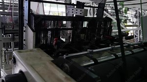 Loom creates fabric from needles and threads, slow shooting