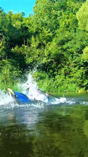 Mastering kayak tricks on a beautiful summer river