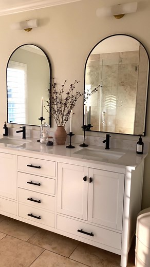 I thought we were going to gut all the travertine tile in our bathroom to make it look more up to date. But with a little bit of paint, along with a new vanity/mirrors, it just gives a warm and organic vibe that I didn't know I needed 🤍 #hometiktok #homedecor #bathroomdecor