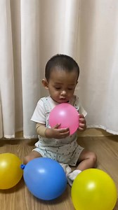 A squeeze balloon activity for toddlers offers many developmental...