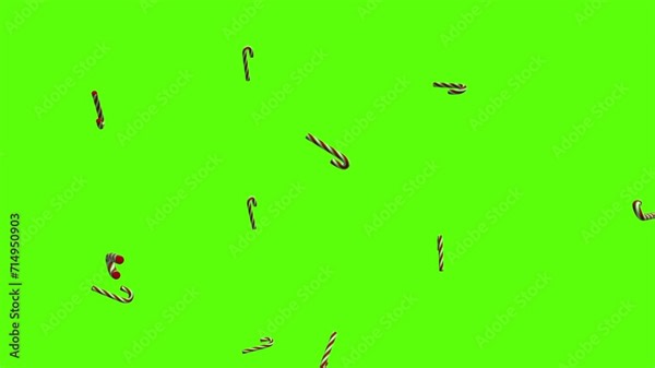 Candy canes background. Falling candy canes over green screen or chroma key. Rain of candy canes across the screen.