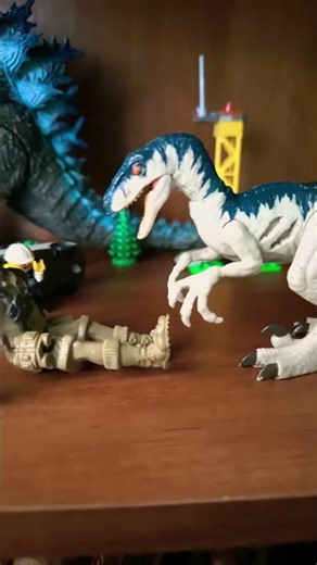 Velociraptor roars and attacks human