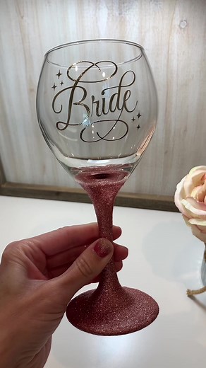 The perfect custom gift for the beautiful bride 👰‍♀️💍🍷✨ @luckylittlepennycrafts #makeitwithmichaels #cricut #glitteredwineglass #personalizedwineglass #glitterwineglasstutorial