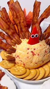 141K views · 1.9K reactions | Gobble gobble! 旅 Kids will love this cute Turkey Pimento Cheese Ball - great for parties, it tastes like pimento cheese but looks like a turkey with feathers made of bacon and pecans. Fun & yum!!Comment LINK & I’ll send ya the recipe now. 李 https://www.momlovesbaking.com/turkey-pimento-cheeseball/ #thanksgivingfood #thanksgivingrecipes #cheeseball | Mom Loves Baking | Facebook