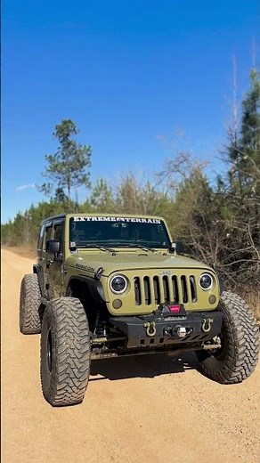 This Jeep's camo paint job and rooftop tent are made for epic getaway! 🛠️
