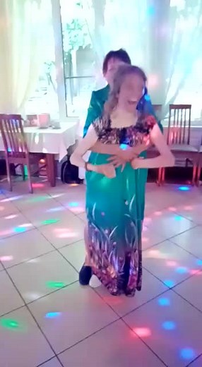 Romantic Slow Dance in Colorful Festive Room