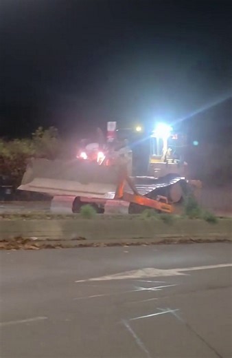 Shock moment 'stolen' 24-tonne bulldozer ploughs through Royal Mail lorry
