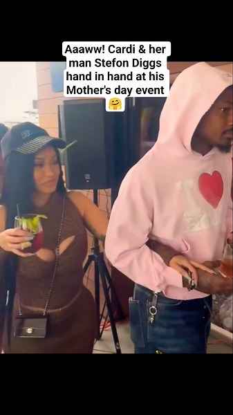 Cardi & her man Stefon Diggs hand in hand at his Mother's day event 🤗