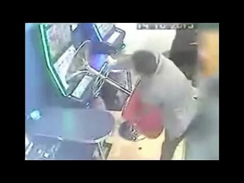 Angry man smashes and destroys slot machines with metal stool in Romford , UK