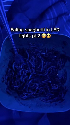 Eating Spaghetti in Blue LED Lights: Funny Video Girl