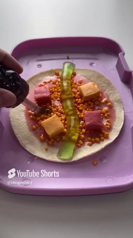 Packing school lunch with candy pizza slices