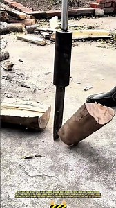 Manually Splitting Wood Using a Heavy Duty Slide Hammer