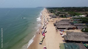 Drone view of Sea and the Beach in India, beautiful beach and shacks on Goa beach