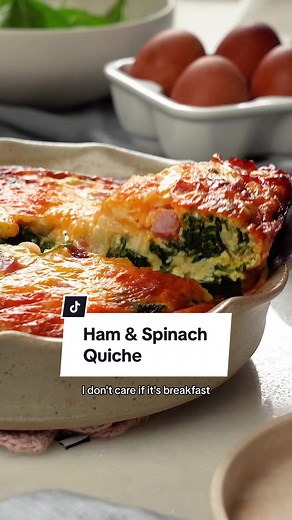 This ham and spinach quiche is ideal for any meal, from brunch to dinner and all the moments in between. This quiche skips the crust, making it incredibly easy to pull together even on short notice. Swap out the Cheddar cheese for Gruyère or use Swiss chard in place of the spinach for a slightly different spin. Ingredients - 1 teaspoon extra-virgin olive oil - 1 cup chopped sweet onion - 1 tablespoon thinly sliced garlic - 6 cups baby spinach - 6 large eggs - 1/2 cup half-and-half - 1/8 teaspoon