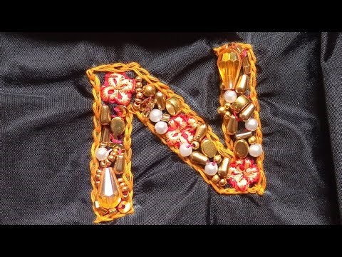 # floral embellished monogram letter N stitching with normal needle.
