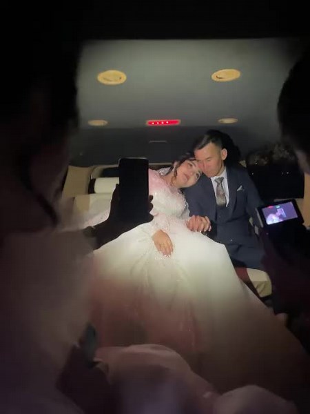 Elegant Wedding Couple in Luxurious Limousine