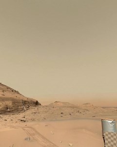 Mars presents a daytime sky that stands in stark contrast to Earth’s. Rather than the familiar blue, it’s tinted in hues of red or butterscotch, a result of fine dust suspended in its thin atmosphere. With far less air to scatter sunlight, the Sun appears smaller and fainter, casting gentle shadows and illuminating the surface with a subdued, amber glow. Occasionally, delicate clouds of water-ice drift overhead, while dust devils twist silently across the dusty plains. The planet’s small moons, 