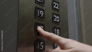 Pushing Elevator Button. Hand pressing lift button up to high floor of office building or hotel. Pushing Elevator button of modern residential condominium. Inside elevator. Using disinfection lift.