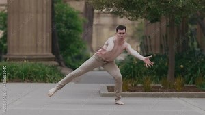 Male ballet dancer jumping and moving body in slow motion. San Francisco, USA