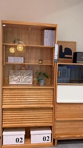 Solid oak storage pieces have a quiet way of transforming a room. They don’t demand attention — they elevate the space through calm structure and natural warmth. A cabinet with glass doors and soft-close wooden panels, like the one in the video, brings that perfect balance of display and discretion: open shelves for personality, closed compartments for everyday practicality. It’s a thoughtful approach that keeps a home feeling intentional rather than crowded. One of today’s most loved design tre