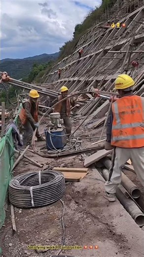 Construction Process : “ Inserting bundle steel wires into dam wall .”