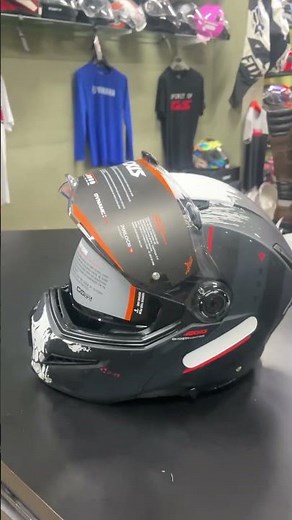 an Axxis Ghostfighter SV helmet with a matte finish and skull graphics