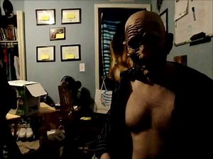 82 year old man flexes his pecs