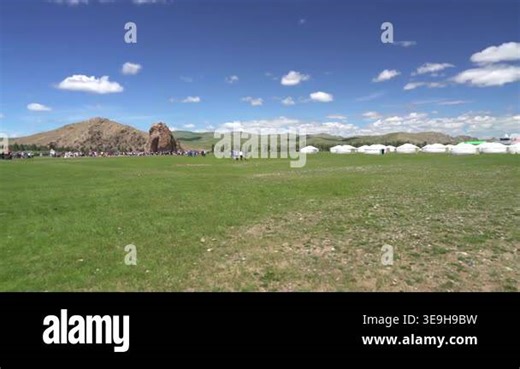 Taikhar Rock monumental granite outcrop rising beside river valley landscape in central Mongolia. monolith marks ritual heritage, pilgrimage appeal, steppe symbolism, cultural destination. central asia, stone formation, natural monument Stock Video Footage - Alamy