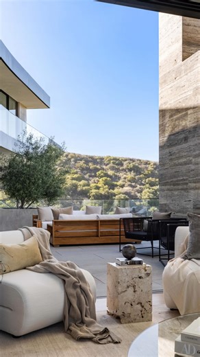 Inside an incredible $27.95M Brentwood estate by @landrydesigngroup A dramatic spiral staircase, marble kitchen island, and floor-to-ceiling glass define the expansive living spaces. City and ocean views stretch endlessly beyond the serene infinity pool and spa, completing this extraordinary home. Listed for sale with @cindyambuehl | The Luxury Home Show