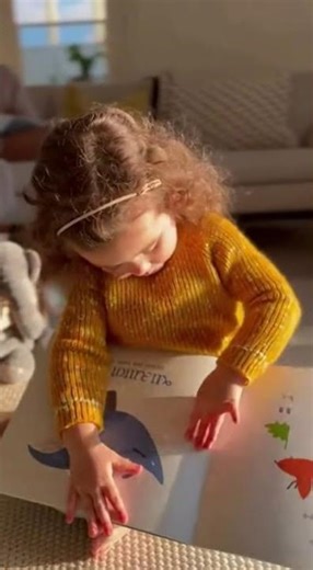 Adorable Little Girl "Reads" Book Like Mom