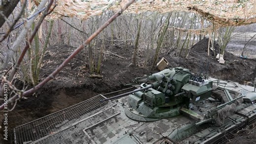 Modern Russian armor in Ukraine: This is a BMD-4M fighting vehicle in a dug-in position, equipped with a field-modified 'cope cage' to protect it from kamikaze drones.