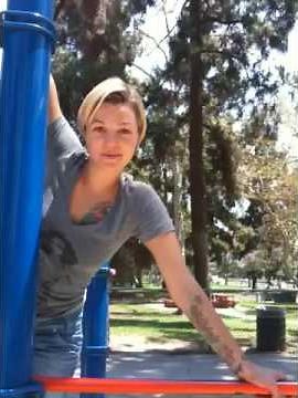 Taking a ride on a pole in the park