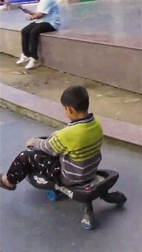 Little kid playing alone at Mall in Darjeeling